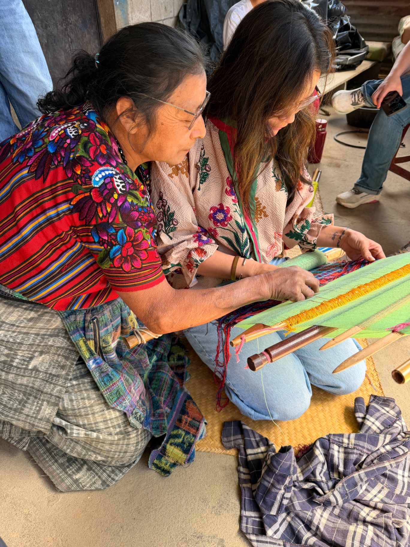 Learning a traditional craft side-by-side with a local artisan in Guatemala