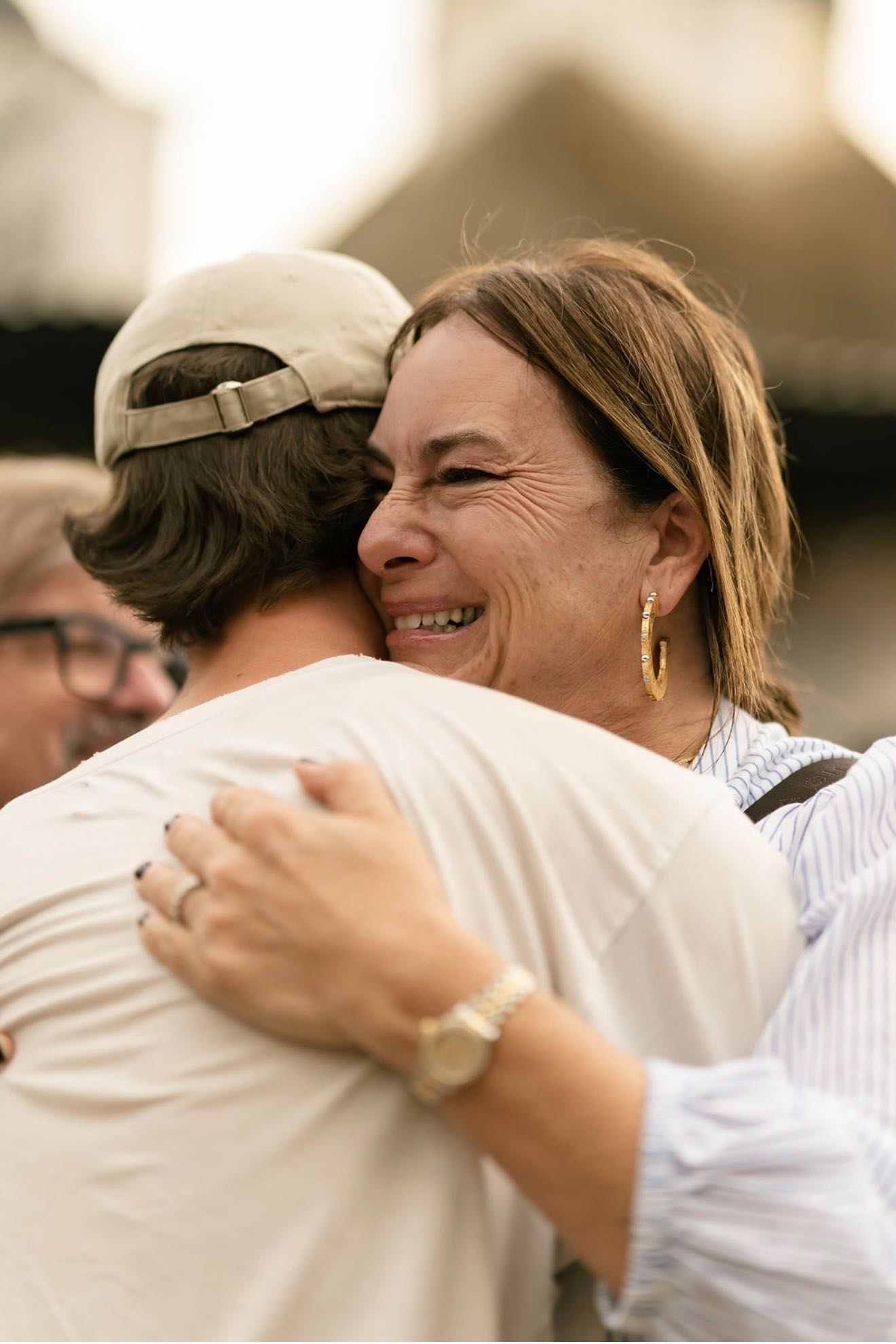 Noelle embracing a parent during a Parent Ministry gathering