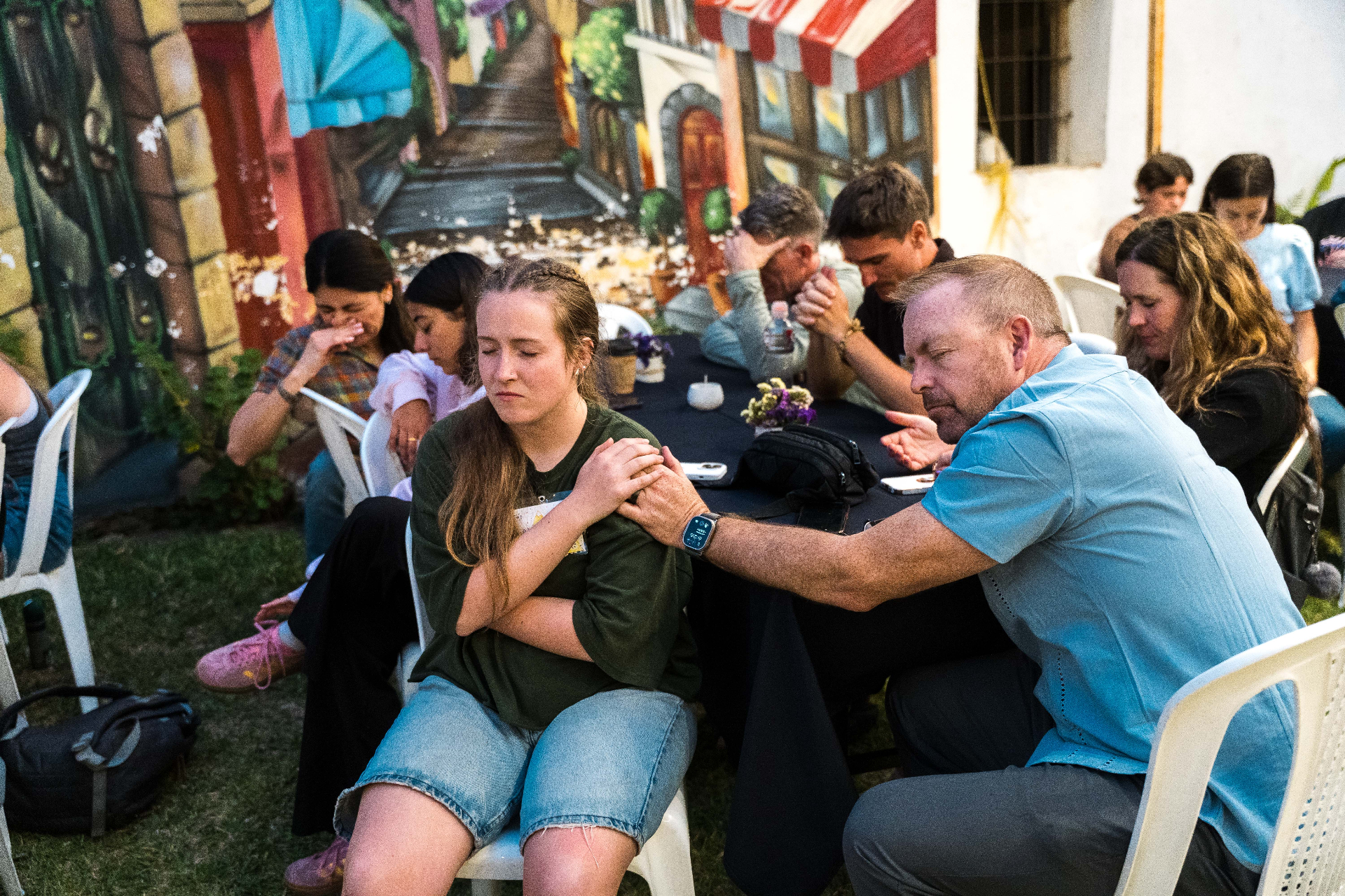 A father praying over his daughter on a Parent Vision Trip in Guatemala