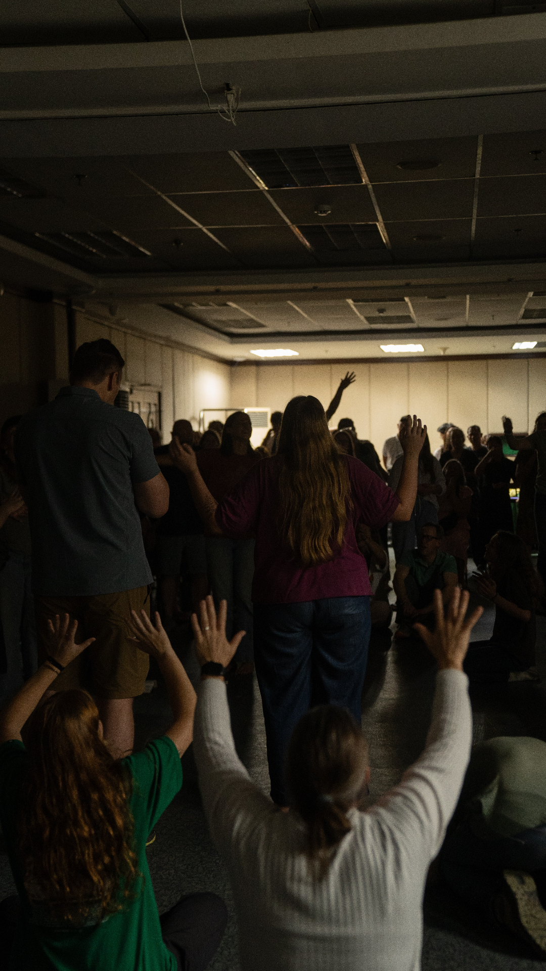 Parents and Racers gathered in prayer at a Parent Vision Trip