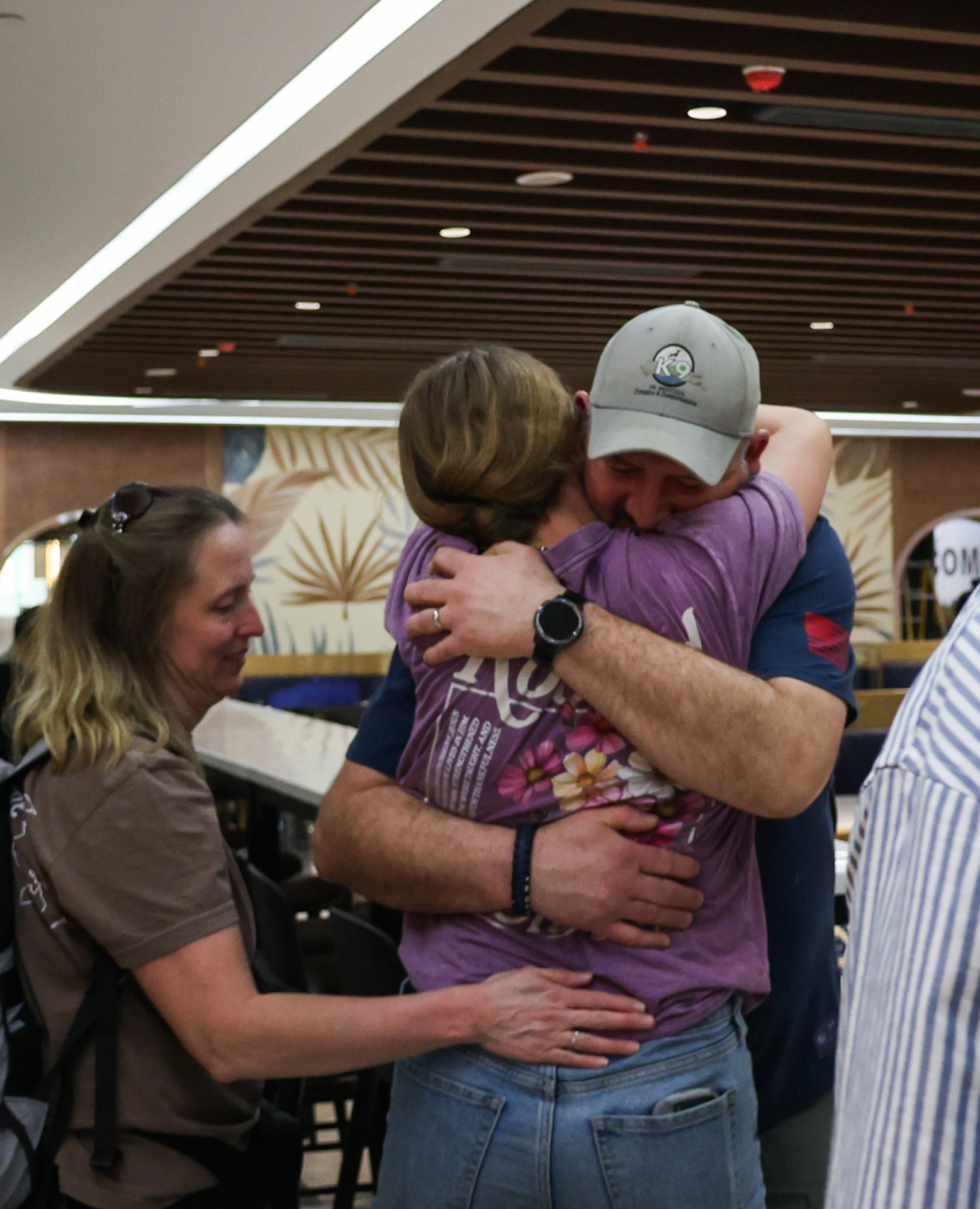 Parent embracing their Racer on the field