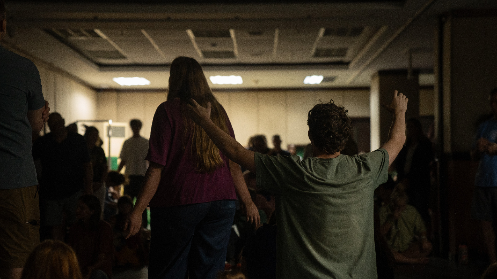 Parents praying over a Racer in worship on a Parent Vision Trip