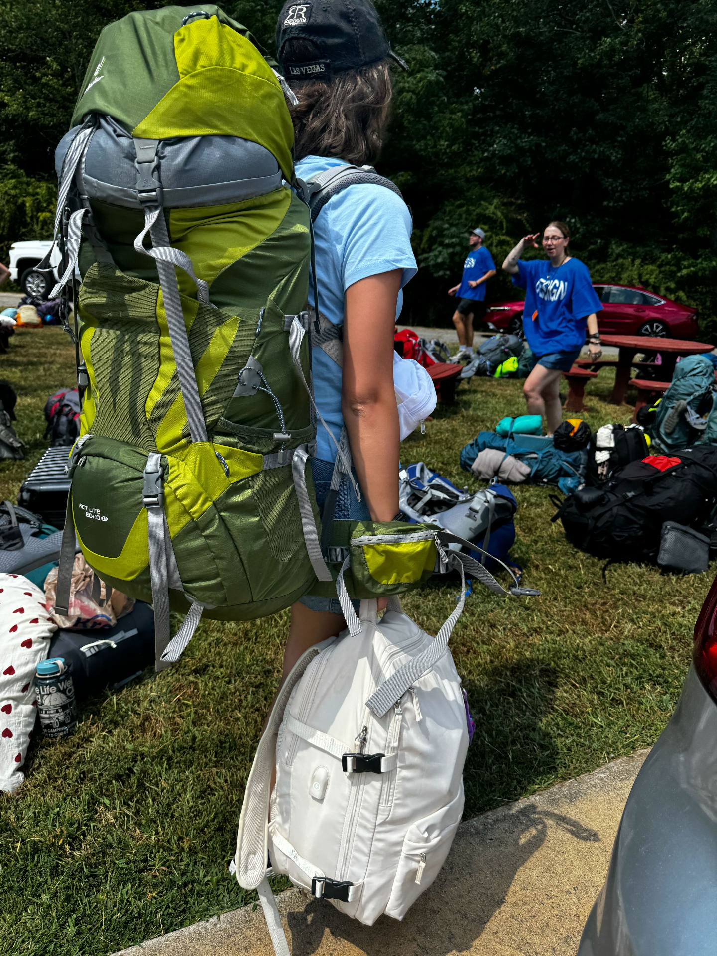 Sophia at World Race training camp wearing her green expedition pack